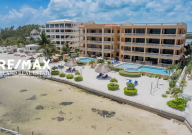 Arial view of Hol Chan Resort, showcasing the beachfront luxury condo at San Pedro, Ambergris Caye, Belize, highlighting its proximity to the Caribbean Sea and lush surroundings