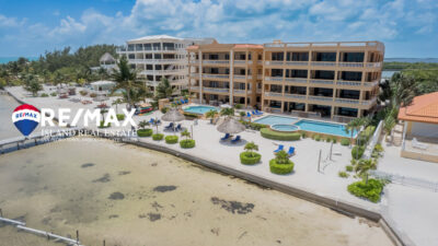 Arial view of Hol Chan Resort, showcasing the beachfront luxury condo at San Pedro, Ambergris Caye, Belize, highlighting its proximity to the Caribbean Sea and lush surroundings