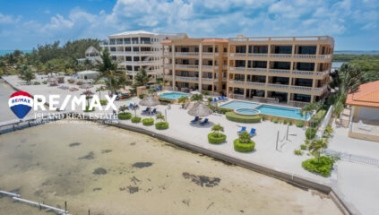 Arial view of Hol Chan Resort, showcasing the beachfront luxury condo at San Pedro, Ambergris Caye, Belize, highlighting its proximity to the Caribbean Sea and lush surroundings