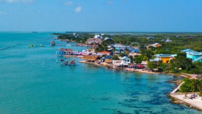 Stunning aerial view of San Pedro, Belize, showcasing its vibrant beaches, crystal-clear waters, and lively atmosphere, ideal for investment and tourism.