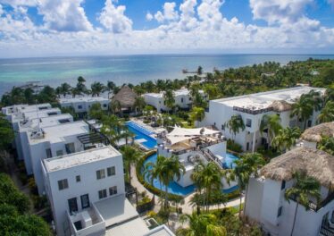 Aerial view of Las Terrazas Resort, Ambergris Caye, showcasing beachfront location and tropical grounds.