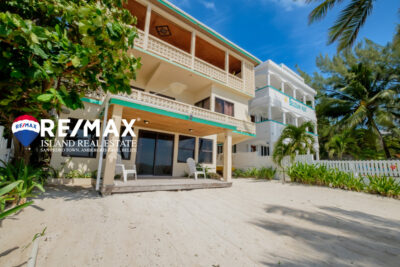 View of Emeralda Lodge condo building from the ocean, located on a beachfront property in San Pedro, with direct access to the beach