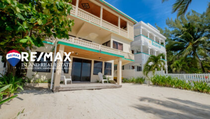 View of Emeralda Lodge condo building from the ocean, located on a beachfront property in San Pedro, with direct access to the beach