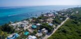 Aerial view of Casa Sur on South Ambergris Caye, highlighting the spacious duplex property, nearby amenities, and the beautiful island surroundings