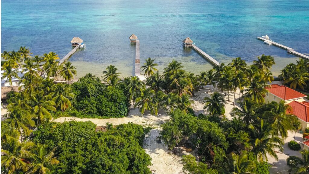 Scenic aerial view of the Ambergris Caye coastline showcasing the beauty and investment potential of the Belize Real Estate Market.